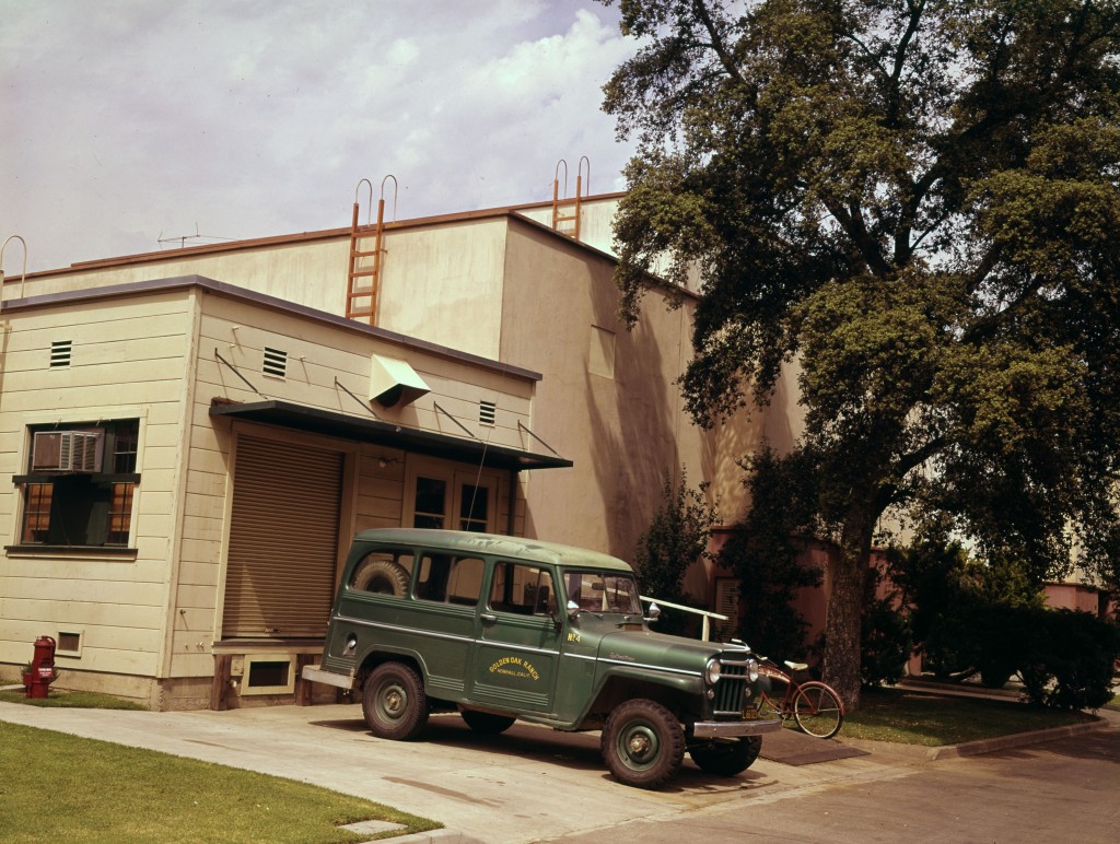 A truck from Golden Oak Ranch is parked outside the bungalow in this historic image.
